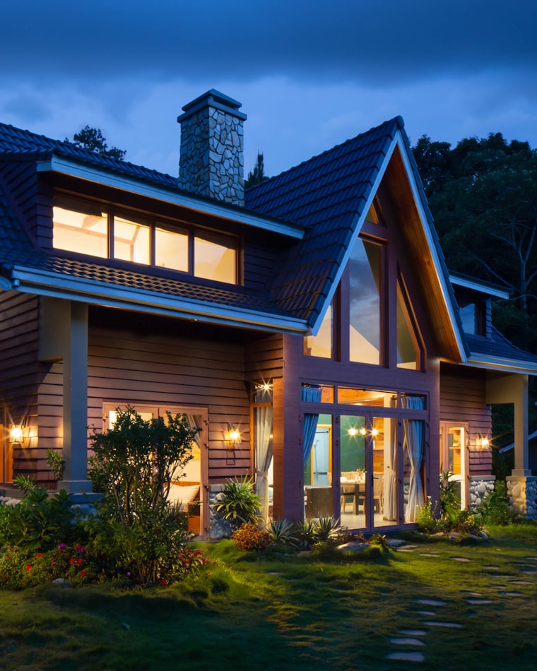 Georgia home at dusk with the lights on